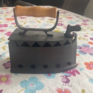 Antique cast charcoal iron.